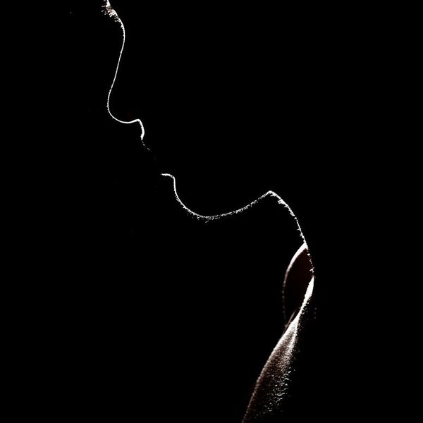 Silhouette of a person stretching, feeling energized with citron accents.